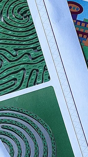 A cropped close up of four printed out sheets from the activity packs, showing different activities. One sheet shows bottles with different coloured liquids in them, one sheet shows mazes, and the other two sheets show geometric shapes.